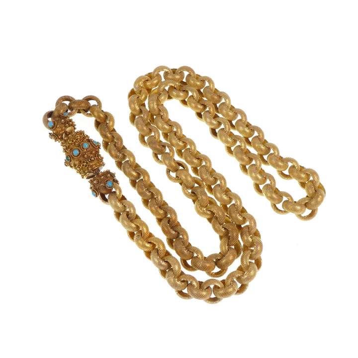 Gold muff chain with large beaded links on a gold and turquoise barrel clasp